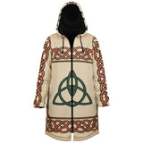 A hooded long coat with a cream base, featuring a green Celtic triquetra symbol on the front, red and black Celtic knot patterns on the sleeves and hem, and a black interior lining.
