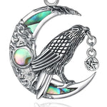 Close-up of abalone shell raven pendant