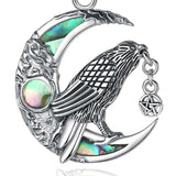 Close-up of abalone shell raven pendant