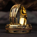 Gold ring with intricate design on a dark background