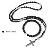 Black onyx beaded necklace with a silver cross pendant on a white background