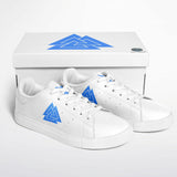 A pair of white low-top sneakers with blue geometric mountain logos on the sides, displayed in front of their white box packaging on a clean white background.