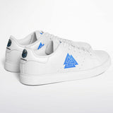 A pair of white low-top sneakers with a prominent blue geometric triangle logo on the side and a blue circular heel patch, photographed on a clean white background.