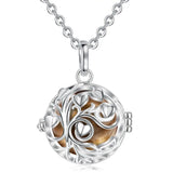 Silver necklace with a tree of life pendant on a white background
