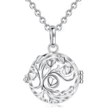 Silver tree of life pendant necklace on a white background