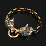 Bracelet with wolf head designs in gold and silver on a black background