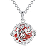 Silver necklace with a red and silver tree of life pendant on a white background