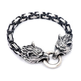 Bracelet with wolf head designs on a white background