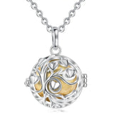Silver and gold round pendant necklace on a white background