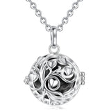 Silver tree of life pendant necklace on a white background