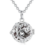 Silver tree of life pendant necklace on a white background