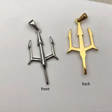 Gold and silver trident pendant on a white background
