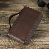 Brown leather wallet on a wooden surface with 'Contacts' branding.