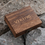 Wooden box with 'Viking' engraving on a stone surface