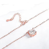Rose gold necklace with a heart-shaped zircon pendant on a white background