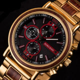 wooden watch with gold and wood accents on a dark background