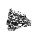 Silver skull ring with a crown on a white background