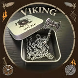 Viking-inspired jewelry set with axe and warrior chain in a tin, surrounded by decorative elements on a brown background.