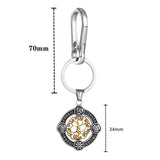 Keychain with tree of life design and measurements on a white background