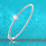 Silver bracelet with a diamond on a blue background
