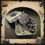 Viking-inspired jewelry set with pendant and necklace in a box, surrounded by decorative elements.