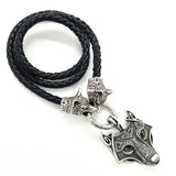 Black braided leather necklace with silver wolf head pendant on a white background