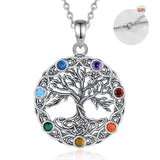 Tree of Life pendant with colorful gemstones on a white background