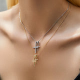Necklace with cross pendants on a person's neck