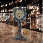 Wine goblet with wolf design on a bar counter