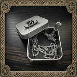 Viking-inspired jewelry set in a tin with decorative background