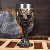 Decorative goblet with intricate designs on a wooden stand