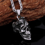 Skull pendant with snake necklace on a dark background