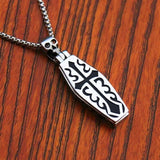 cross design on a coffin that opens inside and lies a skeleton inside