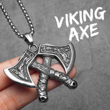 Silver Viking axe pendant held by a hand with 'Viking Axe' text on a gray background