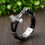Bracelet with Thor's hammer design on a wooden surface